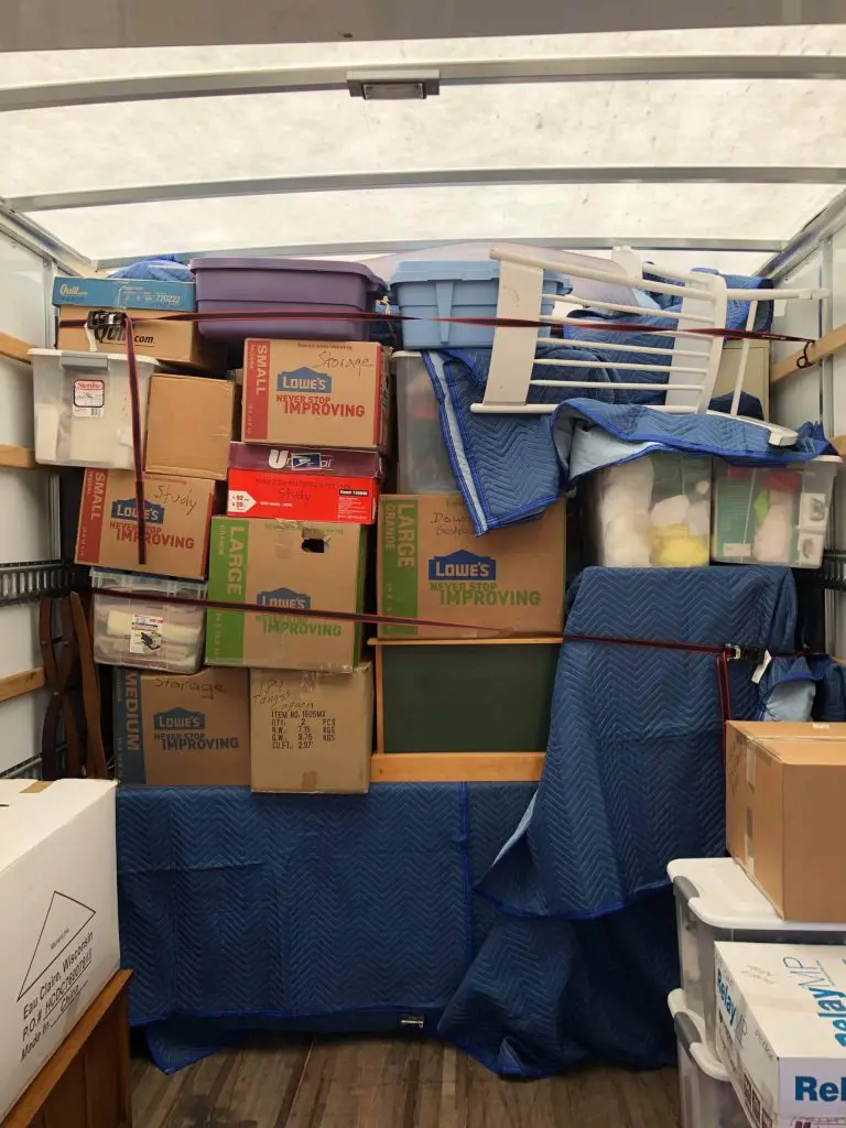 Boxes in a cargo hold with cargo protection coverage from MVM Moving & Storage