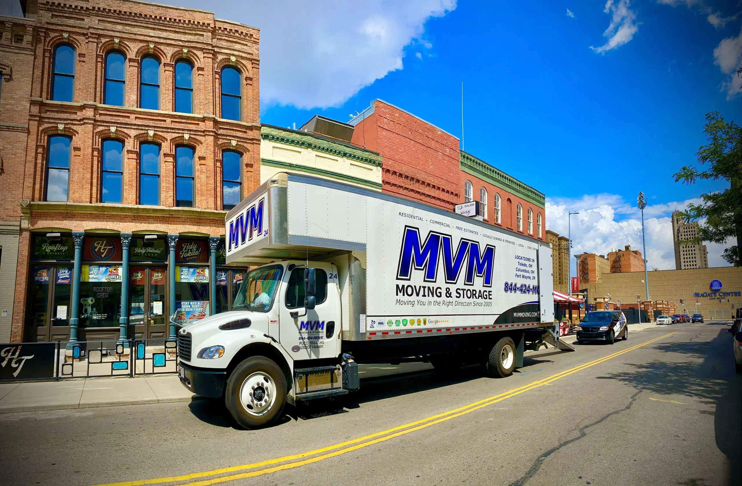 MVM Moving Truck outside an office building for a corporate relocation.
